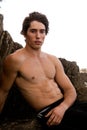 Shirtless Young Man By Rock Formation