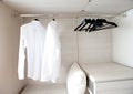 Shirts hanging on built-in cloths racks Royalty Free Stock Photo