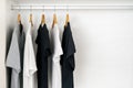 Shirts on wooden hangers on a rail inside wardrobe Royalty Free Stock Photo