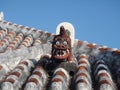 Shisa lion dog guardian on a traditional tile roof in Okinawa, Japan Royalty Free Stock Photo