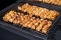 Shish kebab from chicken, pepper and bacon. Grilled vegetable and meat skewers on a grill pan Royalty Free Stock Photo