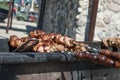 shish kebab on coals. street lighting. bright sunny day. have toning. close-up