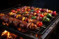 Shish kebab or shish kebab, grilled barbecue with vegetables. Fried pieces of pork meat on metal skewers Royalty Free Stock Photo