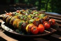 Shish kebab or shish kebab, grilled barbecue with vegetables. Fried pieces of pork meat on metal skewers Royalty Free Stock Photo