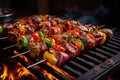 Shish kebab or shish kebab, grilled barbecue with vegetables. Fried pieces of pork meat on metal skewers Royalty Free Stock Photo