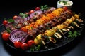 Shish kebab or shish kebab, grilled barbecue with vegetables. Fried pieces of pork meat on metal skewers Royalty Free Stock Photo