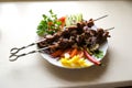 Shish kebab with mushrooms, cherry tomato and sweet pepper, Grilled meat skewers. Top view, copyspace. most important Royalty Free Stock Photo