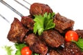 Shish kebab on skewer over white