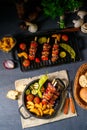 Shish kebab with various vegetables and spice country potatoes