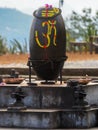 Shiva Lingam, Shiva Lingas with Om symbol painted on, wrapped with Rudraksha in Dhulikhel, Nepal