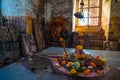 Shiva Lingam temple interior ornate with flowers and colors at holy Omkareshwar, India.