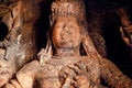 Shiva lord face designed in 6th century in Hindu temple of Badami, India. Artwork on stone carvings