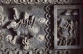 Shiva Lord and his wife Parvati on carved wall of 12th century temple in India