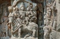 Shiva, Parvati and bull Nandi on wall of Indian temple. Example of ancient architecture, India.