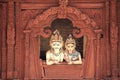 Shiva and Parvati looking down from a balcony. Royalty Free Stock Photo