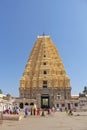 Shiva Virupaksha Temple. Hampi, Karnataka, India. White yellow restored temple against the blue sky. Carving stone Royalty Free Stock Photo