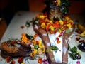 Shivalingam of Lord Shiva with garlands and milk offered on it.