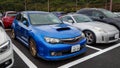 a blue Subaru WRX STI hatchback in a parking lot Royalty Free Stock Photo