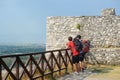 Shkodra, Albania - August 7 2022: Group of tourists visiting famous fortress Rozafa near Shkodra city. People admiring view of