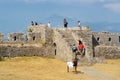 Shkodra, Albania - August 7 2022: Group of tourists visiting famous fortress Rozafa near Shkodra city. People admiring view of