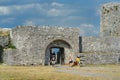 Shkodra, Albania - August 7 2022: Tourists visiting famous fortress Rozafa near Shkodra city. Gates of the bastion lead through an