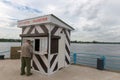 Tourist buys food in a small shop on the pier