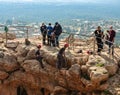 Two athletes begin the descent on a rope down - climbing - snapping - the rope from the mountain to Keshet, Cave in northern