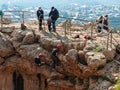 Two athletes begin the descent on a rope down - climbing - snapping - the rope from the mountain to Keshet, Cave in northern