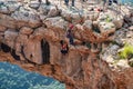 Two athletes make the descent on a rope down - climbing - snapping - the rope from the mountain to Keshet, Cave in northern Israel