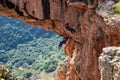 Two athletes make the descent on a rope down - climbing - snapping - the rope from the mountain to Keshet, Cave in northern Israel