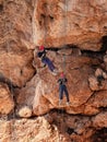 Two athletes make the descent on a rope down - climbing - snapping - the rope from the mountain to Keshet, Cave in northern Israel