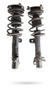 Shock absorber struts with black springs after being used on a car during replacement and repair on a white isolated background.