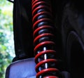 Red shock absorbers on motorcycle Royalty Free Stock Photo