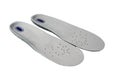 Shock absorbing sports insoles isolated on white background top view. Foam and silicone in the composition, top covering in soft,