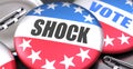 Shock and elections in the USA, pictured as pin-back buttons with American flag colors, words Shock and vote, to symbolize that t