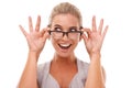 Shock, excited and portrait of a woman with spectacles in a studio with a omg, wow or wtf facial expression. Shocked Royalty Free Stock Photo