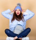 In shock. girl in puffed coat. faux fur fashion. flu and cold season. Leather bag fashion. woman in beanie hat with Royalty Free Stock Photo