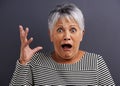 Shock, portrait and senior woman in studio with fear, scared and terror facial expression. Surprise, crazy and elderly Royalty Free Stock Photo