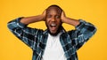 Shocked African American Man Shouting Omg Touching Head, Yellow Background Royalty Free Stock Photo