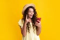Shocked amazed face, surprised emotions of young teenager girl. Teenager child holding cellphone. Close-up portrait of Royalty Free Stock Photo