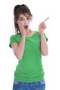 Shocked and amazed young woman in green shirt pointing with her Royalty Free Stock Photo