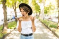 Shocked angry woman scream on smart phone discovering mistake content in the street Royalty Free Stock Photo