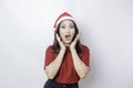 A shocked Asian Santa woman with her mouth wide open isolated by white background. Christmas concept Royalty Free Stock Photo