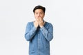 Shocked astounded asian man witness accident, gasping and cover mouth, gossiping with coworkers at office, hear stunning