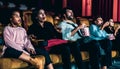 Shocked audience watching a horror movie