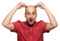 Shocked bald man holds his head. Isolated Royalty Free Stock Photo