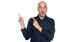 Shocked bald man pointing fingers aside. Isolated Royalty Free Stock Photo