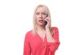 Shocked blond woman listening to a phone call Royalty Free Stock Photo