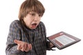 Shocked boy with his tablet pc hacked by a ransomware virus