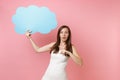 Shocked bride woman in wedding dress pointing index finger on blue empty blank Say cloud speech bubble on